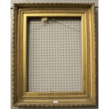 A large gilt wood picture frame.