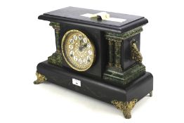 An early 20th century American wooden mantel clock.