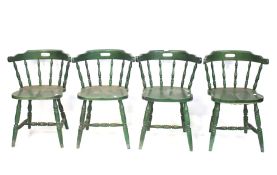 A set of four bow spindle back bar chairs.