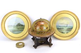A pair of oil on boards, a globe and a brass compass.