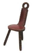 A 19th century oak tripod chair.