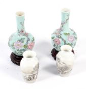 Two pairs of miniature Chinese vases.