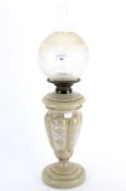 An early 20th century vaseline style glass oil lamp.