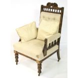 An oak framed, upholstered armchair.