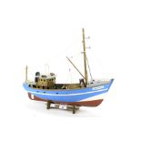 A wooden model of the fishing boat, 'Cornish Belle'.