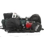 An assortment of camera related accessories and parts.
