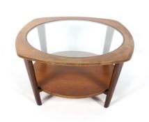 A 1960s glass topped teak coffee table.
