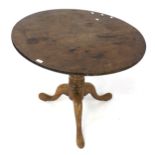 An oak tilt top breakfast circular table.