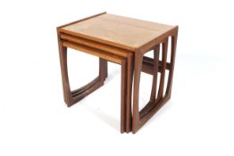 A 1960s nest of three G-Plan teak Quadrille occasional tables. With label, the largest L53.