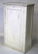 A white painted pine cupboard.