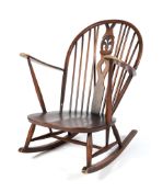 An Enstol rocking chair, with hooped spindle back.