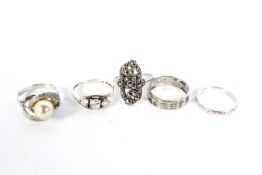 Five white metal rings.