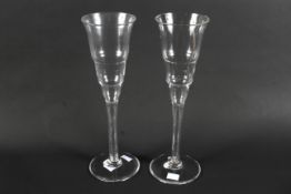 A large pair of retro glass candle holders or goblets.