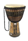 A tribal Tom Tom drum. With a carved wooden frame and leather top, 61.