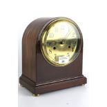 An inlaid English Smith Enfield striking mantel clock.