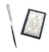 A silver Art Nouveau style address book and silver handled paper knife.