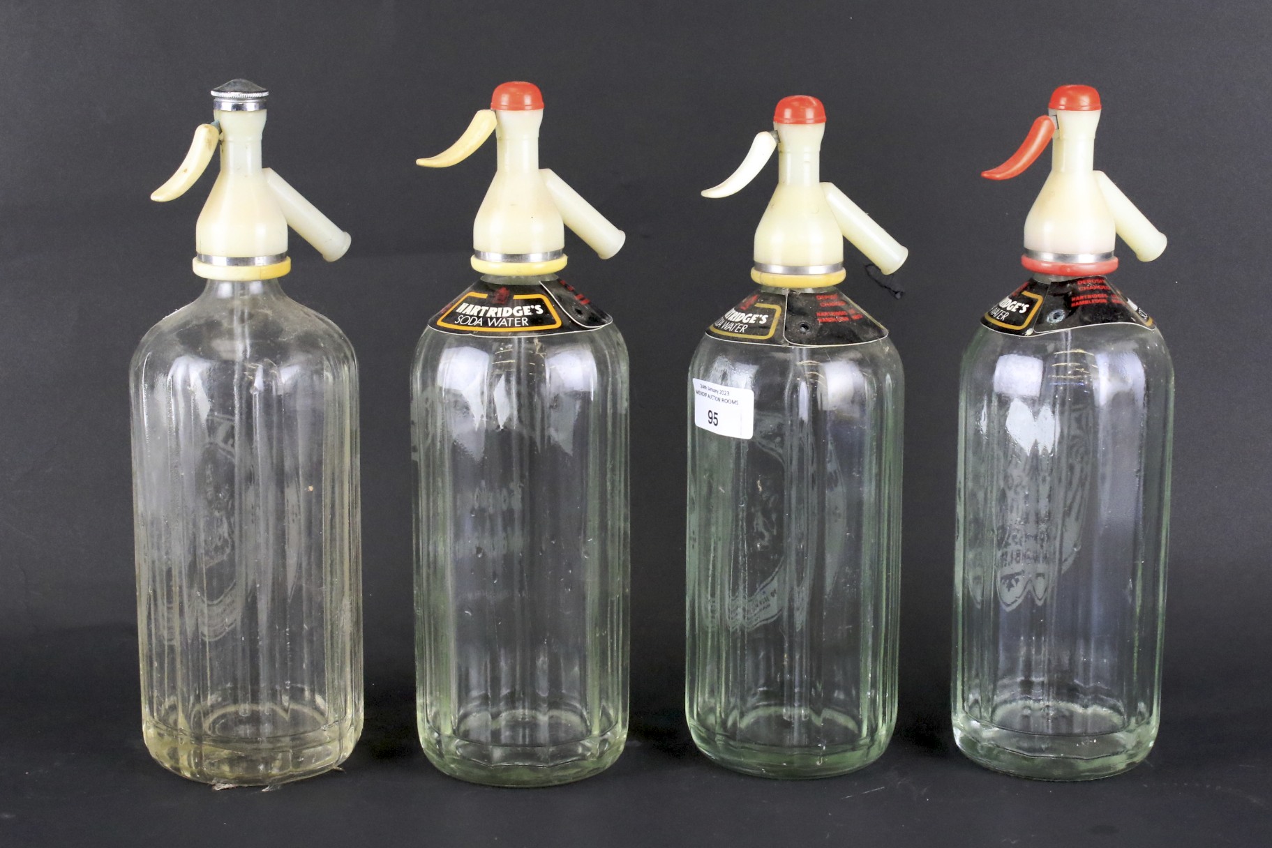 Four vintage glass soda syphons.