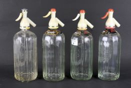 Four vintage glass soda syphons.