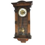 A Vienna style mahogany wall clock. Striking, pendulum and key.