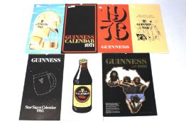 Seven 1970s and 1980s Guinness calendars.
