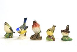 Five ceramic birds.