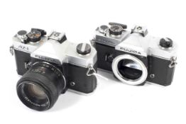 Two Fujica 35mm SLR cameras. To include an AZ-1 with a 55mm 1:1.