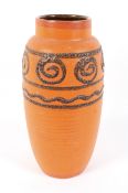 A 1960s West Germany pottery vase in orange glaze. Moulded W.