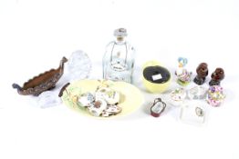 An assortment of mixed ceramic and glass collectables.
