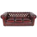 A modern Chesterfield three person settee.