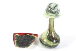 A Poole pottery shaped dish and green glass bottle-shaped decanter and ball stopper.