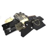 Twelve assorted vintage clutch handbags and a contemporary black purse.