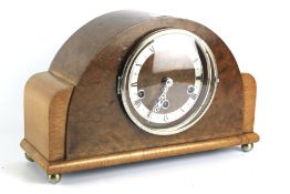 A Westminster chiming mantel clock. Walnut veneer, with German movement, case marked C.W.S. Ltd.