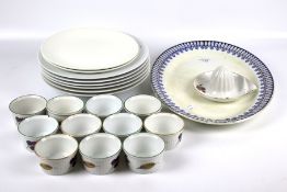 An assortment of Evesham ceramics and a set of Royal Worcester plates.