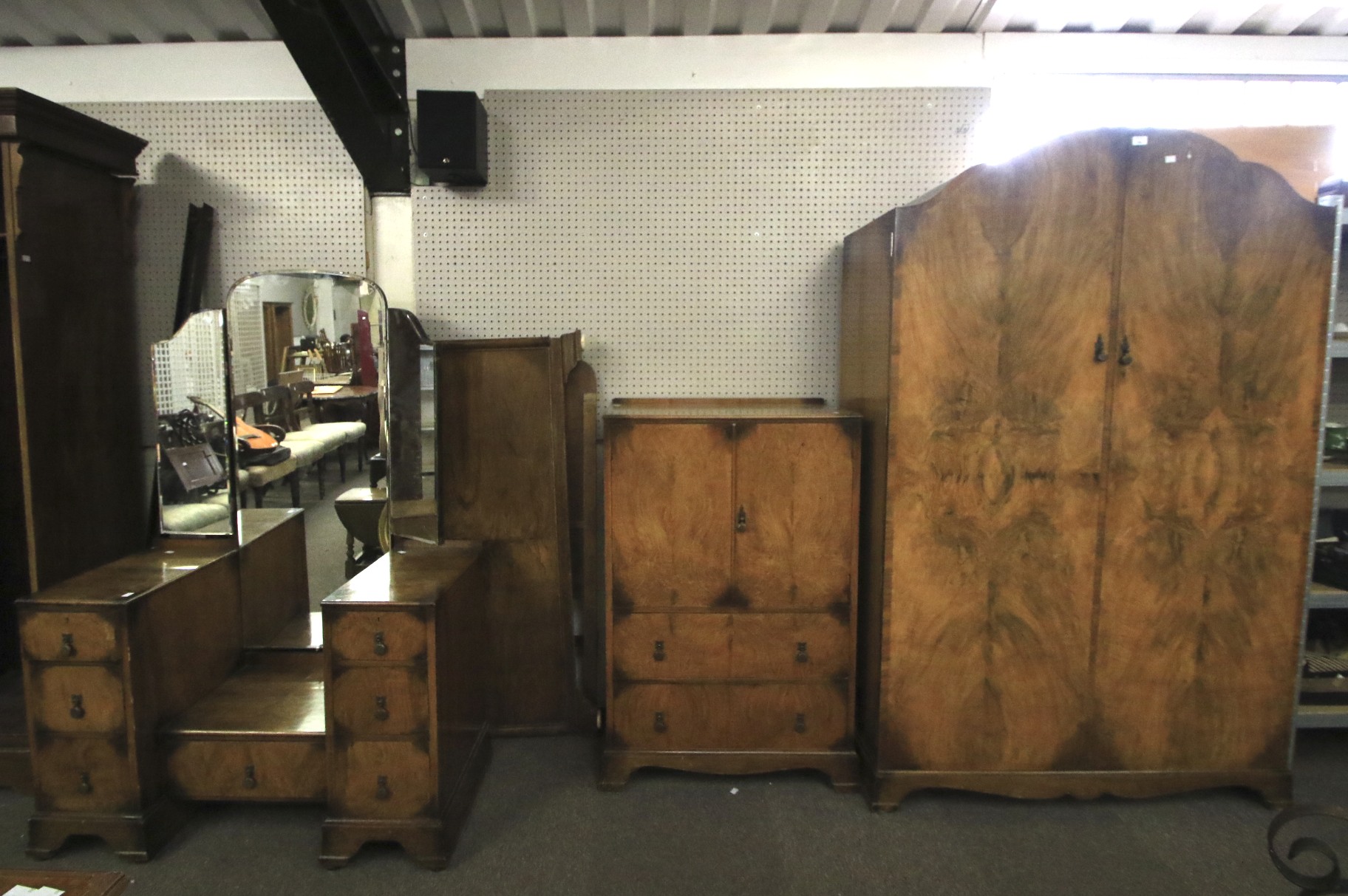 An Art Deco burr walnut veneered four piece bedroom suite.