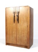 An Art Deco oak two door cabinet.