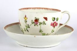 A 19th century porcelain hand painted teacup and saucer.