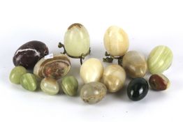 Fifteen assorted carved and polished natural stone eggs. Including marble and agate.