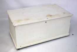 A white painted oak blanket box.