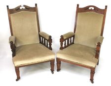 A pair of 20th century mahogany framed open armchairs.