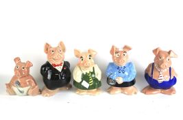 Five assorted Wade ceramic piggy banks for Natwest.