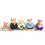 Five assorted Wade ceramic piggy banks for Natwest.