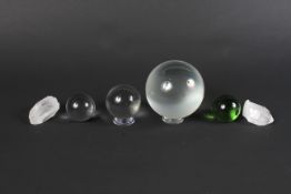 A 'witches' glass ball with stand, two green glass balls and two crystals. Of assorted sizes.