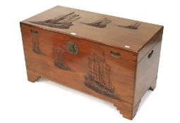 A contemporary camphor wood oriental chest trunk.