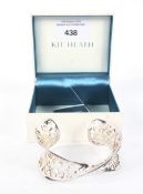 A contemporary white metal Kit Heath bangle.