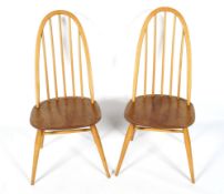 Two Ercol Windsor Quaker light beech and elm dining chairs. Stamped B.S.