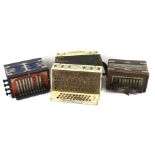 Three assorted button accordions. Including 'The charmer', Antoria 'Champion Band' and a 'Venezia'.