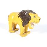 A retro papier-mache model of a lion.