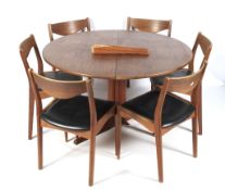 A 1960s SL Mobler (Denmark) circular dining table and six dining chairs.