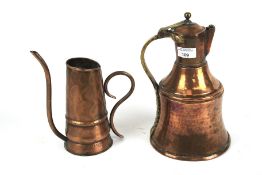 A beaten copper watering can and a copper stein.