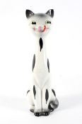 A mid-century Italian stylised pottery model of a cat. Enriched with black markings, 32.